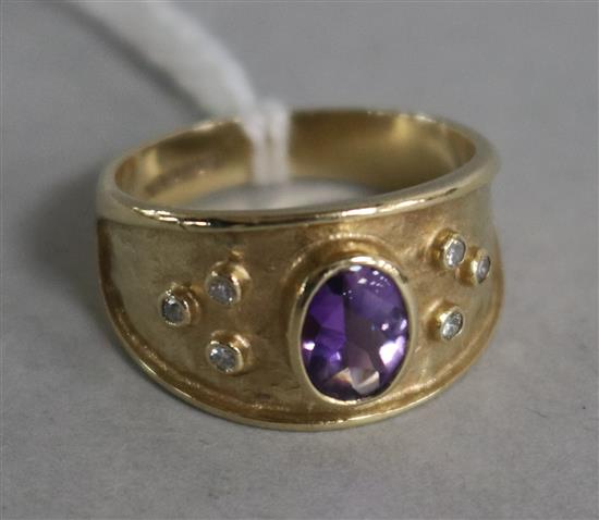 A Burrells 9ct gold, amethyst and diamond dress ring, size N.